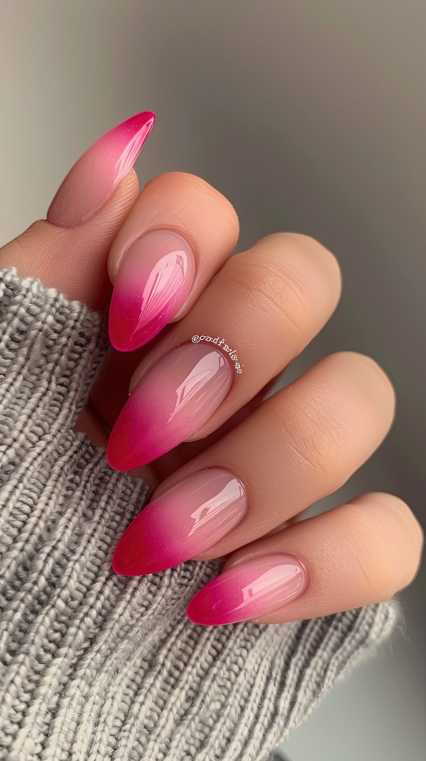 woman-with-pink-nails-that-has-flower-it