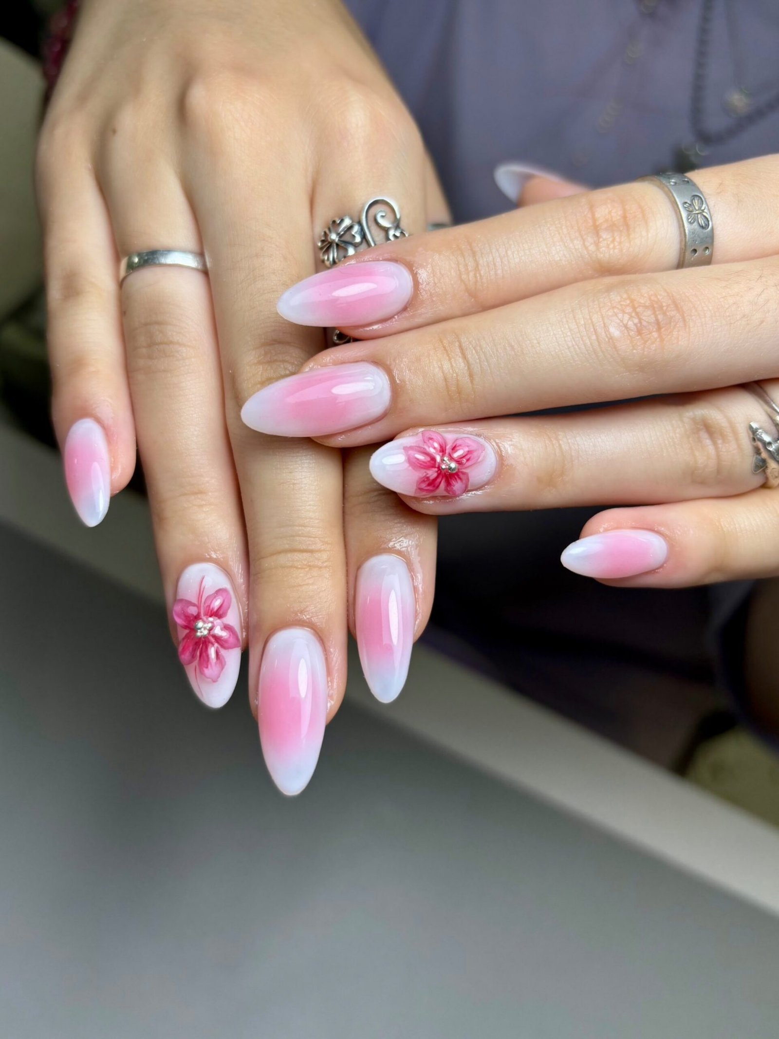 woman-with-pink-nails-that-says-48-nails